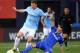 NEW YORK, NY - MAY 25: Edin Dzeko #10 of Manchester City tries to keep the ball as Andreas Christensen #32 of Chelsea slides at Yankee Stadium on May 25, 2013 in the Bronx borough of New York City. Manchester City defeated Chelsea 5-3. (Photo by Elsa/Getty Images)