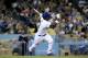 LOS ANGELES, CA - JUNE 07: Yasiel Puig #66 of the Los Angeles Dodgers hits a solo home run in the sixth inning against the Atlanta Braves at Dodger Stadium on June 7, 2013 in Los Angeles, California. (Photo by Stephen Dunn/Getty Images)