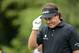 Jun 13, 2013; Ardmore, PA, USA; Phil Mickelson tips his hat to the gallery on the 11th tee during the first round of the 113th U.S. Open golf tournament at Merion Golf Club. Mandatory Credit: JD Mercer-USA TODAY Sports