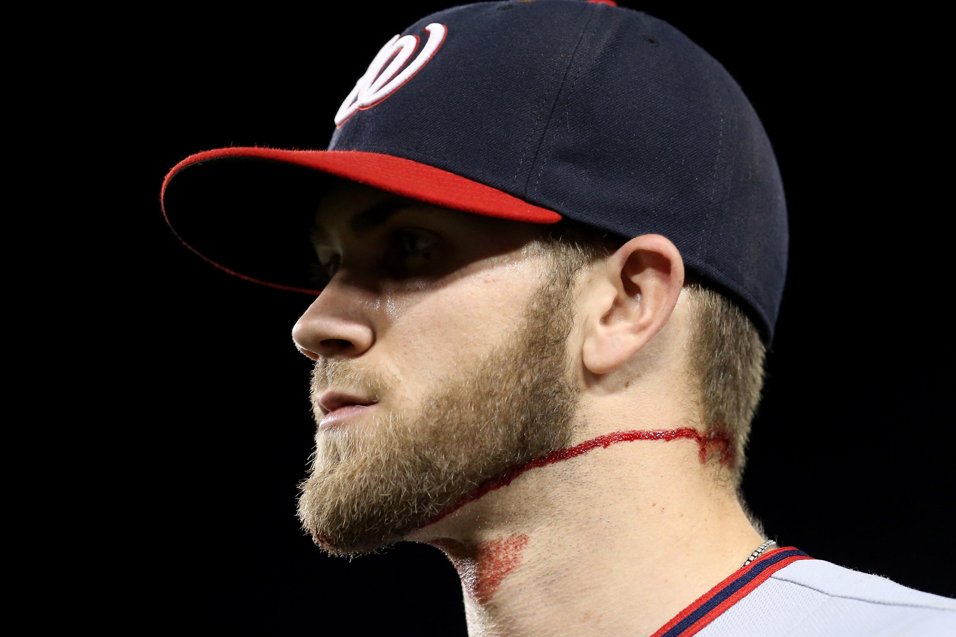 Bryce Harper trades his headband with a young Phillies fan