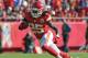 KANSAS CITY, MO - NOVEMBER 18: Running back Jamaal Charles #25 of the Kansas City Chiefs rushes past defensive back Adam Jones #24 of the Cincinnati Bengals during the first half on November 18, 2012 at Arrowhead Stadium in Kansas City, Missouri. Cincinnati defeated Kansas City 28-6. (Photo by Peter Aiken/Getty Images)