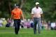 ARDMORE, PA - JUNE 14: (L-R) Rory McIlroy of Northern Ireland and Tiger Woods of the United States walk up the tenth hole during Round Two of the 113th U.S. Open at Merion Golf Club on June 14, 2013 in Ardmore, Pennsylvania. (Photo by Ross Kinnaird/Getty Images)