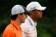 ARDMORE, PA - JUNE 14: (L-R) Rory McIlroy of Northern Ireland and Tiger Woods of the United States walk up the tenth hole during Round Two of the 113th U.S. Open at Merion Golf Club on June 14, 2013 in Ardmore, Pennsylvania. (Photo by Rob Carr/Getty Images)