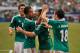 Jun 3, 2012; Arlington, TX, USA; Mexico forward Giovani dos Santos (10) and forward Javier Chicharito Hernandez (14) and midfielder Andres Guardado (18) celebrate a goal against Brazil during the first half at Cowboys Stadium. Mexico shut out Brazil 2-0. Mandatory Credit: Jerome Miron-USA TODAY Sports