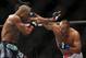Jun 15, 2013; Winnipeg, MB, Canada; Rashad Evans (left) fights Dan Henderson during their light heavyweight bout at UFC 161 at MTS Centre. Mandatory Credit: Tom Szczerbowski-USA TODAY Sports