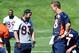 May 30, 2013; Englewood, CO, USA; Denver Broncos quarterback Peyton Manning (18) and wide receiver Wes Welker (83) talk during organized team activities at the Broncos training facility. Mandatory Credit: Ron Chenoy-USA TODAY Sport