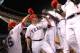 The Rangers had a lot to high five about after recording 14 hits in a 9-4 win over the A's on Wednesday night