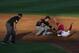 Jun 19, 2013; Omaha, NE, USA; Oregon State Beavers shortstop Tyler Smith (1) tags out Indiana Hoosiers runner Chris Sujka (4) at second base during the College World Series at TD Ameritrade Park. Mandatory Credit: Bruce Thorson-USA TODAY Sports