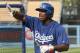 LOS ANGELES, CA - JUNE 11: Yasiel Puig #66 of the Los Angeles Dodgers gestures as he talks to teammates during batting practice before the game against the Arizona Diamondbacks at Dodger Stadium on June 11, 2013 in Los Angeles, (Photo by Stephen Dunn/Getty Images)