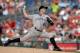 WASHINGTON, DC - JUNE 20: Starter Roy Oswalt #44 of the Colorado Rockies throws a pitch in the second inning during a game against the Washington Nationals at Nationals Park on June 20, 2013 in Washington, DC. (Photo by Patrick McDermott/Getty Images)