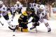 BOSTON, MA - JUNE 19: Rich Peverley #49 of the Boston Bruins tries to handle the puck against Jonathan Toews #19 of the Chicago Blackhawks in Game Four of the 2013 NHL Stanley Cup Final at TD Garden on June 19, 2013 in Boston, Massachusetts. (Photo by Elsa/Getty Images)