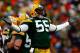 GREEN BAY, WI - DECEMBER 07: Desmond Bishop #55 of the Green Bay Packers celebrates after recording a sack against the Houston Texans during the second quarter at Lambeau Field on December 7, 2008 in Green Bay, Wisconsin. The Texans defeated the Packers 24-21. (Photo by Jeff Gross/Getty Images)