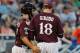 Jun 17, 2013; Omaha, NE, USA; Mississippi State Bulldogs catcher Nick Ammirati (17) talks with pitcher Chad Girodo (18) against the Indiana Hoosiers during the College World Series at TD Ameritrade Park. Mandatory Credit: Bruce Thorson-USA TODAY Sports