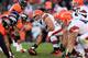 DENVER, CO - DECEMBER 23: Center Alex Mack #55 of the Cleveland Browns prepares to snap the ball to quarterback Brandon Weeden #3 of the Cleveland Browns against the Denver Broncos at Sports Authority Field at Mile High on December 23, 2012 in Denver, Colorado. The Broncos defeated the Browns 34-12. (Photo by Doug Pensinger/Getty Images)