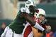 EAST RUTHERFORD, NJ - DECEMBER 02: Ryan Lindley #14 of the Arizona Cardinals is sacked by Muhammad Wilkerson #96 of the New York Jets on December 2, 2012 at MetLife Stadium in East Rutherford, New Jersey. The New York Jets defeated the Arizona Cardinals 7-6. (Photo by Elsa/Getty Images)