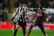 NEWCASTLE UPON TYNE, ENGLAND - NOVEMBER 22: Newcastle player Hatem Ben Arfa (l) challenges CS Maritimo defender Joao Luiz during the UEFA Europa League Group match between Newcastle United FC and CS Maritimo at St James' Park on November 22, 2012 in Newcastle upon Tyne, England. (Photo by Stu Forster/Getty Images)