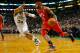 BOSTON, MA - MARCH 8: Josh Smith #5 of the Atlanta Hawks drives to the basket in front of Paul Pierce #34 of the Boston Celtics during the game on March 8, 2013 at TD Garden in Boston, Massachusetts. NOTE TO USER: User expressly acknowledges and agrees that, by downloading and or using this photograph, User is consenting to the terms and conditions of the Getty Images License Agreement. (Photo by Jared Wickerham/Getty Images)