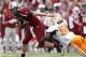 COLUMBIA, SC - OCTOBER 27: Connor Shaw #14 of the South Carolina Gamecocks tries to avoid Curt Maggitt #56 of the Tennessee Volunteers during the game at Williams-Brice Stadium on October 27, 2012 in Columbia, South Carolina. South Carolina won 38-35. (Photo by Joe Robbins/Getty Images)