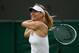 LONDON, ENGLAND - JUNE 26: Maria Sharapova of Russia plays a backhand during her Ladies' Singles second round match against Michelle Larcher de Brito of Portugal on day three of the Wimbledon Lawn Tennis Championships at the All England Lawn Tennis and Croquet Club on June 26, 2013 in London, England. (Photo by Dennis Grombkowski/Getty Images)