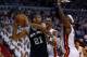 MIAMI, FL - JUNE 20: Tim Duncan #21 of the San Antonio Spurs looks to pass against LeBron James #6 and Chris Bosh #1 of the Miami Heat in the fourth quarter during Game Seven of the 2013 NBA Finals at AmericanAirlines Arena on June 20, 2013 in Miami, Florida. NOTE TO USER: User expressly acknowledges and agrees that, by downloading and or using this photograph, User is consenting to the terms and conditions of the Getty Images License Agreement. (Photo by Mike Ehrmann/Getty Images)