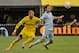 COLUMBUS, OH - OCTOBER 7: Josh Williams #3 of the Columbus Crew and Graham Zusi #8 of Sporting Kansas City battle for control of the ball on October 7, 2012 at Crew Stadium in Columbus, Ohio. (Photo by Jamie Sabau/Getty Images)
