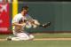 Jun 22, 2013; San Francisco, CA, USA; San Francisco Giants infielder Nick Noonan (21) fields a ground ball against the Miami Marlins in the eighth inning at AT&T Park. Mandatory Credit: Cary Edmondson-USA TODAY Sports