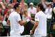 LONDON, ENGLAND - JUNE 27: Tomas Berdych of Czech Republic shakes hands at the net with Daniel Brands of Germany after their Gentlemen's Singles second round match on day four of the Wimbledon Lawn Tennis Championships at the All England Lawn Tennis and Croquet Club on June 27, 2013 in London, England. (Photo by Clive Brunskill/Getty Images)