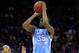 KANSAS CITY, MO - MARCH 24: Reggie Bullock #35 of the North Carolina Tar Heels attempts a shot in the first half against Travis Releford #24 of the Kansas Jayhawks during the third round of the 2013 NCAA Men's Basketball Tournament at Sprint Center on March 24, 2013 in Kansas City, Missouri. (Photo by Jamie Squire/Getty Images)