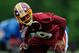 ASHBURN, VA - MAY 06: Richard Crawford #39 of the Washington Redskins stretches during the Washington Redskins rookie minicamp on May 6, 2012 in Ashburn, Virginia. (Photo by Patrick McDermott/Getty Images)