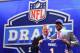 NEW YORK, NY - APRIL 25: E.J. Manuel of the Florida State Seminoles stands with NFL Commissioner Roger Goodell (L) as they hold up a jersey on stage after Manuel was picked #16 overall by the Buffalo Bills in the first round of the 2013 NFL Draft at Radio City Music Hall on April 25, 2013 in New York City. (Photo by Al Bello/Getty Images)