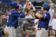 NEW YORK, NY - JUNE 26: Ian Kinsler #5 of the Texas Rangers celebrates with teammte Leonys Martin #2 after scoring on Adrian Beltre #29 two run double in the third inningat Yankee Stadium on June 26, 2013 in the Bronx borough of New York City. (Photo by Mike Stobe/Getty Images)