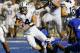 BOISE, ID - SEPTEMBER 20: Taysom Hill #4 of the BYU Cougars is brought down by the Boise State Broncos at Bronco Stadium on September 20, 2012 in Boise, Idaho. (Photo by Otto Kitsinger III/Getty Images)