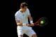 LONDON, ENGLAND - JULY 01: Andy Murray of Great Britain plays a backhand during the Gentlemen's Singles fourth round match against Mikhail Youzhny of Russia on day seven of the Wimbledon Lawn Tennis Championships at the All England Lawn Tennis and Croquet Club on July 1, 2013 in London, England. (Photo by Julian Finney/Getty Images)