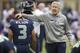 SEATTLE, WA - OCTOBER 14: Seattle Seahawks head coach Pete Carroll pats Russell Wilson #3 of the Seattle Seahawks on the head before a game against the New England Patriots at CenturyLink Field on October 14, 2012 in Seattle, Washington. (Photo by Stephen Brashear/Getty Images)