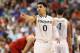 GREENSBORO, NC - MARCH 16: Shane Larkin #0 of the Miami Hurricanes points in the second half while taking on the North Carolina State Wolfpack during the men's ACC Tournament semifinals at Greensboro Coliseum on March 16, 2013 in Greensboro, North Carolina. (Photo by Streeter Lecka/Getty Images)