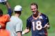 May 30, 2013; Englewood, CO, USA; Denver Broncos quarterback Peyton Manning (18) talks to offensive coordinator Adam Gase (left) before the start of organized team activities at the Broncos training facility. Mandatory Credit: Ron Chenoy-USA TODAY Sports