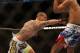 September 22, 2012; Toronto, ON, CANADA; Cub Swanson (left) punches Charles Oliveira during the featherweights fight at UFC 152 at the Air Canada Centre. Mandatory Credit: Tom Szczerbowski-USA TODAY Sports