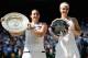 LONDON, ENGLAND - JULY 06: Marion Bartoli of France poses with the Venus Rosewater Dish trophy next to Sabine Lisicki of Germany and her runner-up trophy after their Ladies' Singles final match on day twelve of the Wimbledon Lawn Tennis Championships at the All England Lawn Tennis and Croquet Club on July 6, 2013 in London, England. (Photo by Dennis Grombkowski/Getty Images)