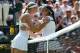 LONDON, ENGLAND - JULY 06: Marion Bartoli of France embraces Sabine Lisicki of Germany at the net after their Ladies' Singles final match on day twelve of the Wimbledon Lawn Tennis Championships at the All England Lawn Tennis and Croquet Club on July 6, 2013 in London, England. (Photo by Dennis Grombkowski/Getty Images)