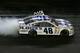 DAYTONA BEACH, FL - JULY 06: Jimmie Johnson, driver of the #48 Lowe's Dover White Chevrolet, celebrates with the checkered flag as he performs a burnout after winning the NASCAR Sprint Cup Series Coke Zero 400 at Daytona International Speedway on July 6, 2013 in Daytona Beach, Florida. (Photo by Scott Halleran/Getty Images)