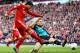 LIVERPOOL, ENGLAND - MARCH 03: Thomas Vermaelen of Arsenal attempts to block the shot by Luis Suarez of Liverpool during the Barclays Premier League match between Liverpool and Arsenal at Anfield on March 3, 2012 in Liverpool, England. (Photo by Clive Mason/Getty Images)