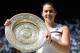 LONDON, ENGLAND - JULY 06: Marion Bartoli of France poses with the Venus Rosewater Dish trophy after her victory in the Ladies' Singles final match against Sabine Lisicki of Germany on day twelve of the Wimbledon Lawn Tennis Championships at the All England Lawn Tennis and Croquet Club on July 6, 2013 in London, England. (Photo by Dennis Grombkowski/Getty Images)
