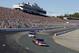 Sep 23, 2012; Loudon, NH, USA; NASCAR Sprint Cup Series driver Denny Hamlin takes turn one during the Sylvania 300 at New Hampshire Motor Speedway. Mandatory Credit: Greg M. Cooper-USA TODAY Sports