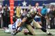 ARLINGTON, TX - DECEMBER 23: Jimmy Graham #80 of the New Orleans Saints makes a fumble recovery against Eric Frampton #27 of the Dallas Cowboys in overtime at Cowboys Stadium on December 23, 2012 in Arlington, Texas. (Photo by Ronald Martinez/Getty Images)
