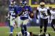 EAST RUTHERFORD, NJ - DECEMBER 09: David Wilson #22 of the New York Giants carries the ball past Isa Abdul-Quddus #42 of the New Orleans Saints to score his third touchdown of the game on December 9, 2012 at MetLife Stadium in East Rutherford, New Jersey. (Photo by Elsa/Getty Images)