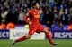 LIVERPOOL, ENGLAND - FEBRUARY 21: Luis Suarez of Liverpool celebrates after scoring his team's third goal from a free kick during the UEFA Europa League round of 32 second leg match between Liverpool FC and FC Zenit St Petersburg at Anfield on February 21, 2013 in Liverpool, England. (Photo by Alex Livesey/Getty Images)
