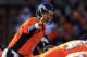 DENVER, CO - DECEMBER 23: Quarterback Peyton Manning #18 of the Denver Broncos directs the offense against the Cleveland Browns at Sports Authority Field at Mile High on December 23, 2012 in Denver, Colorado. The Broncos defeated the Browns 34-12. (Photo by Doug Pensinger/Getty Images)