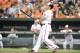 BALTIMORE, MD - JULY 11: Chris Davis #19 of the Baltimore Orioles hits a solo home run in the second inning against the Texas Rangers on July 11, 2013 at Orioles Park at Camden Yards in Baltimore, Maryland. (Photo by Mitchell Layton/Getty Images)