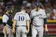 PHOENIX, AZ - JULY 13: Relief pitcher John Axford #59 of the Milwaukee Brewers is removed by manager manager Ron Roenicke #10 during the seventh inning of the MLB game against the Arizona Diamondbacks at Chase Field on July 13, 2013 in Phoenix, Arizona. (Photo by Christian Petersen/Getty Images)