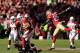 SAN FRANCISCO, CA - DECEMBER 30: Michael Floyd #15 of the Arizona Cardinals is tackled by Dashon Goldson #38 of the San Francisco 49ers while Tarell Brown #25 of the San Francisco 49ers jumps in to help at Candlestick Park on December 30, 2012 in San Francisco, California. (Photo by Ezra Shaw/Getty Images)